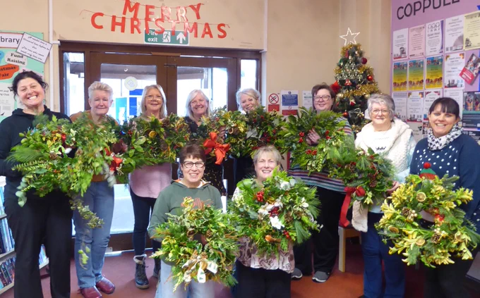 people with wreaths
