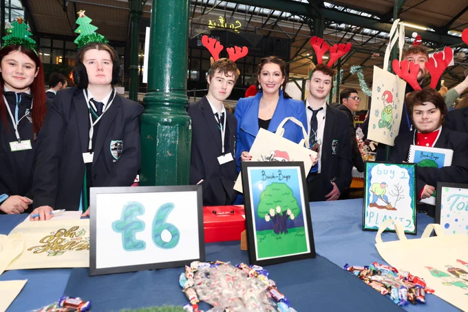 Deputy First Minister Emma Little-Pengelly with pupils from Beechlawn School, Hillsborough at the Young Enterprise Big Market.