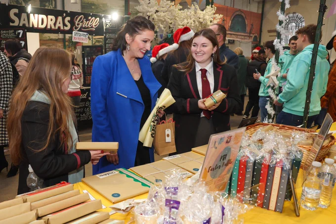Deputy First Minister Emma Little-Pengelly with pupils from Wallace High School, Lisburn, at the Young Enterprise Big Market.