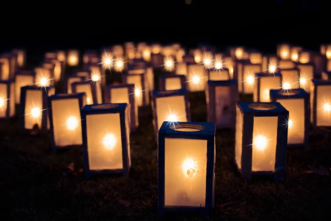 A series of lanterns in the dark