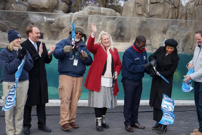 Assistant Deputy Secretary Diana Maas cutting the Penguins of the Pacific ribbon at the Milwaukee County Zoo.