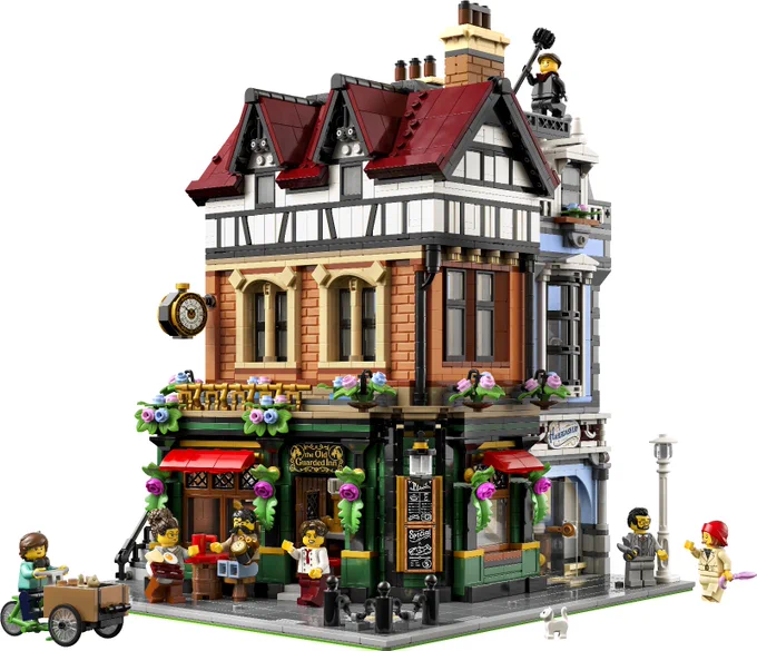 Lego 10350 Tudor Corner. An impressive and intricate building with lots of details, odd angles and a wide variety of elements. It includes an inn, a haberdashery, a watch maker on the first floor and an appartment on top. It's richly decorated with a tudor style, decorative flowers and 7 lively Lego figures.