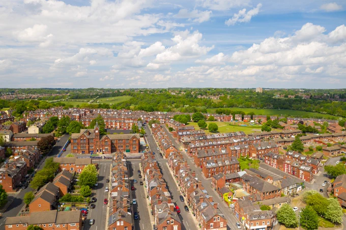An aerial photo of housing in Leeds with countryside in the background.