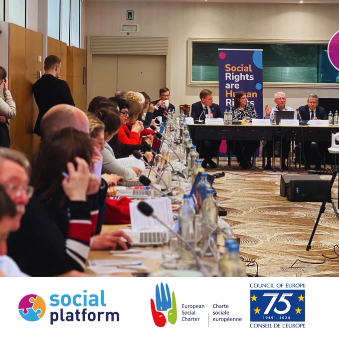 Image of participants and speakers sitting at a roundtable 