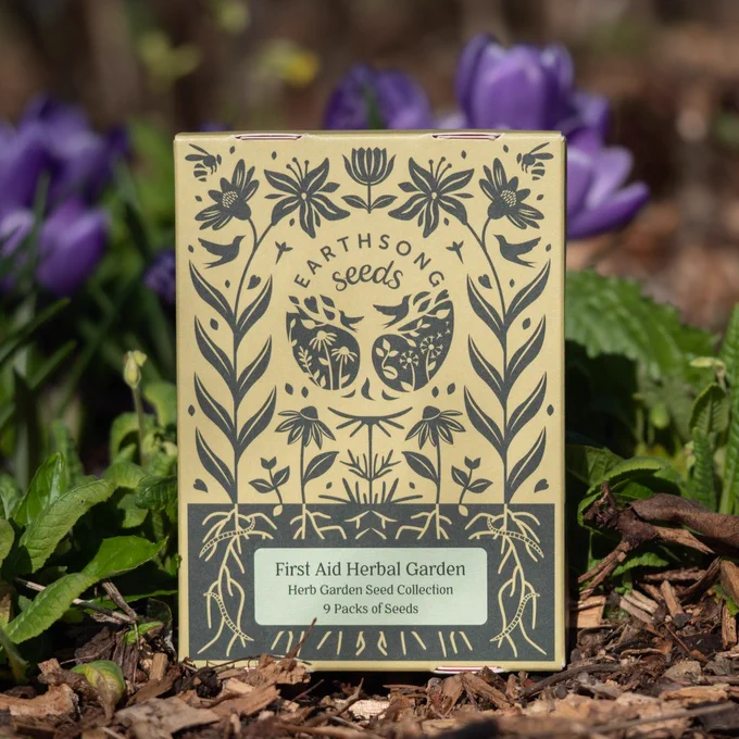 A box labelled 'Earthsong Seeds: first aid herbal garden collection.'