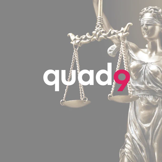 Quad9 logo with a muted image of Lady Justice in the background