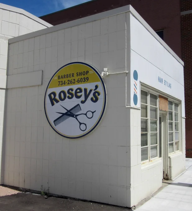 The exterior of Rosey's Barber Shop in 2020.