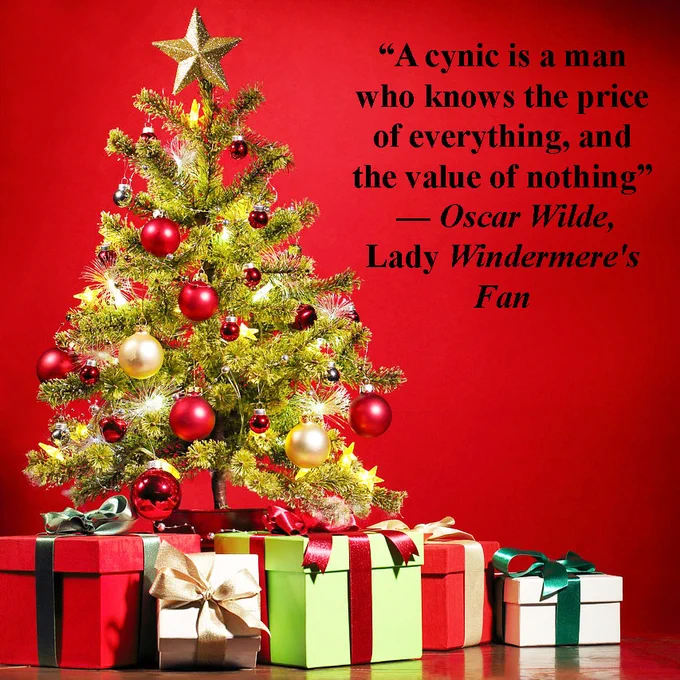 A decorated Christmas tree, with presents underneath it. On the right-hand-side, text reading: “A cynic is a man who knows the price of everything, and the value of nothing” Oscar Wilde, Lady Windermere's Fan