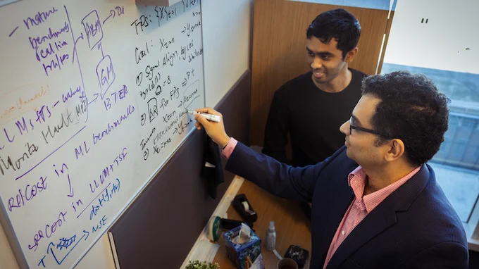 School of CSE Associate Professor B. Aditya Prakash and Ph.D. student Harshavardhan Kamarthi brainstorm together on a machine learning algorithm.