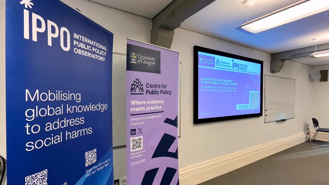 A photo of the IPPO and Centre for Public Policy pop-up banners