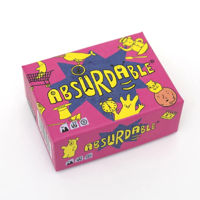 An open box of Absurdable, a card game. It has a bright pink lid that says Absurdable in big, fun letters, and it has several funny illustrations on it in bright yellow: an alien holding a clock, a policeman in a breakfast bowl, a moon in a shopping cart, a hamster on Mars, and a narwhal on a unicycle.