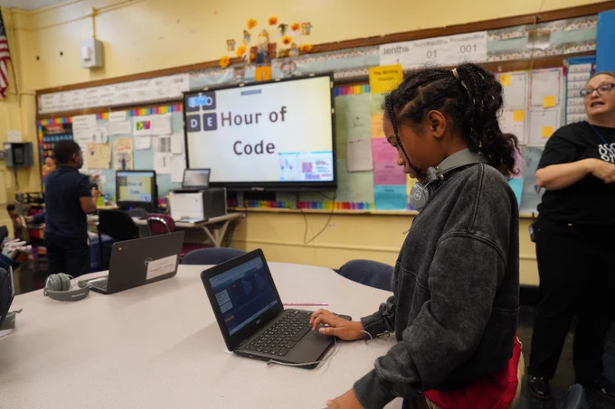 Students at PS 52 Magnet School learning how to code on computers for Computer Science Week.