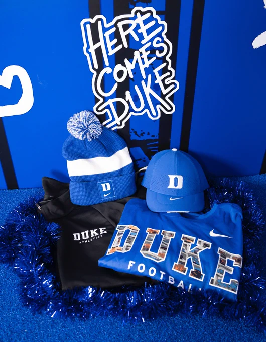 Duke giveaway prize package featuring a beanie, hat, quarter zip and t-shirt.
