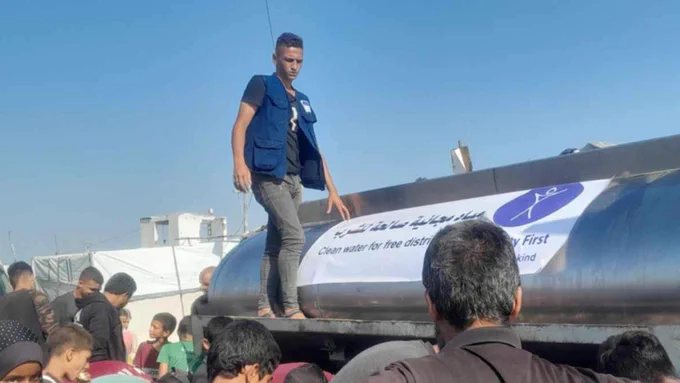 Image of 20-year-old Muhannad Muayyad Abu Awad on a Humanity First truck while volunteering with the charity in Gaza. 