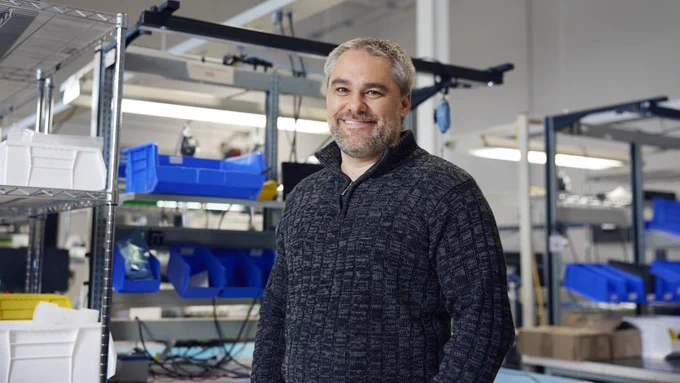 CEO of Miovision Kurtis McBride standing inside of a lab