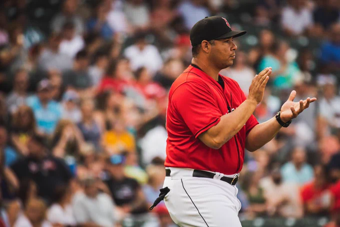 Former Indianapolis Indians manager Miguel Perez claps in front of a packed Victory Field crowd.