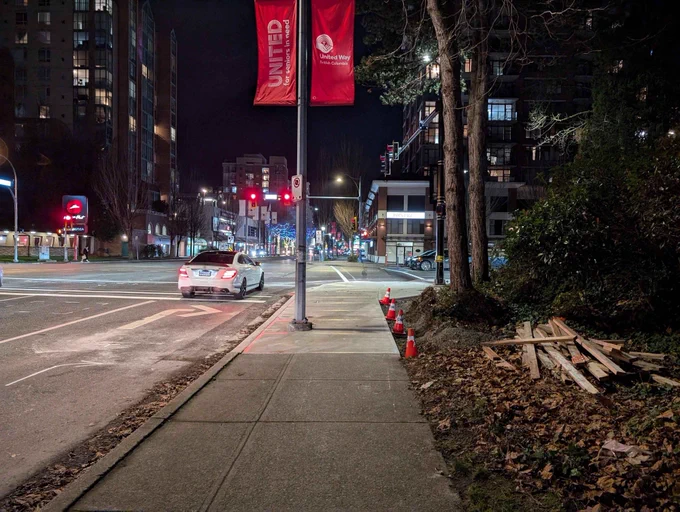 After: same street with the slip lane removed.
