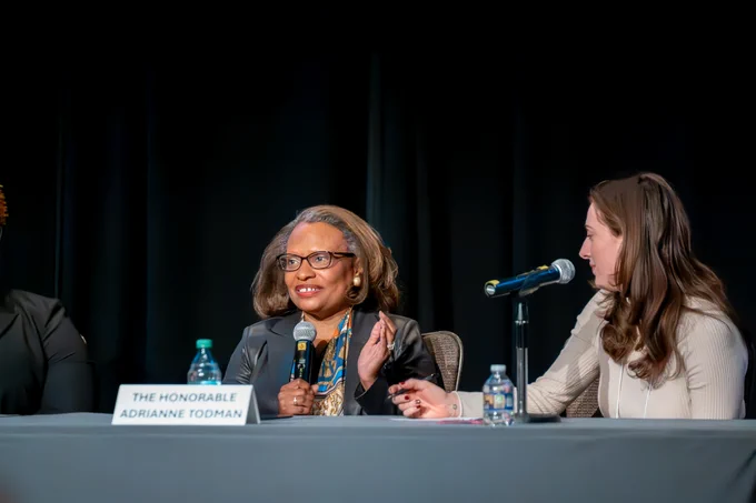 HUD Agency Head Adrianne Todman speaking on stage. 