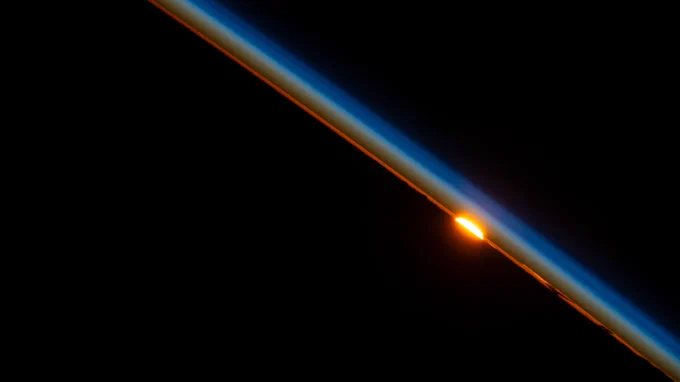 The last rays of an orbital sunset dim in the Earth's atmosphere as the International Space Station orbited above Niger on the African continent.