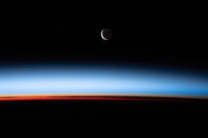 A waxing crescent Moon during is pictured from the International Space Station during an orbital sunset as it flew 268 miles above the Pacific Ocean east of New Zealand.
