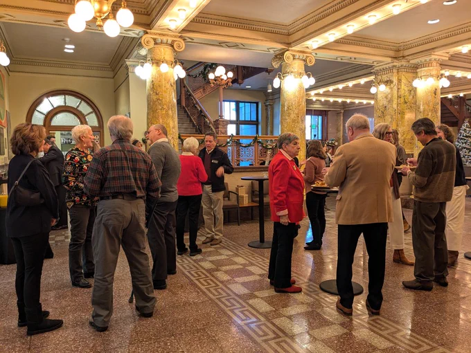 CSP staff and patrons mingle at a Holiday event