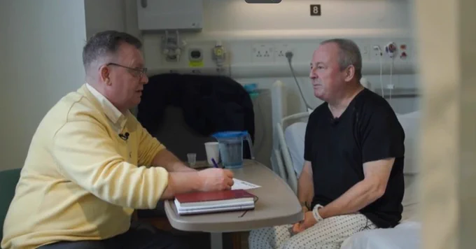 A member of the pathway homeless team speaking to a patient