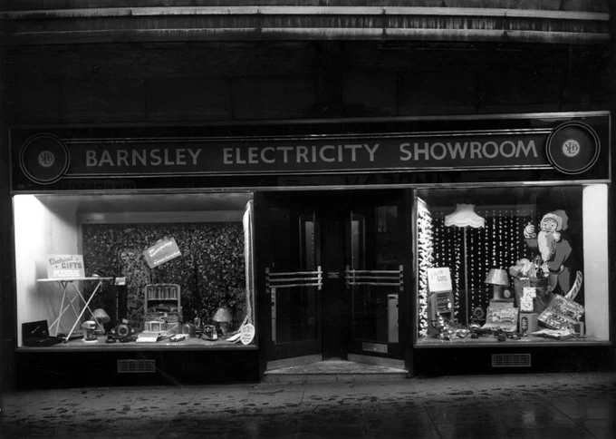 Barnsley Electricity Showroom shop dressed for Christmas, there's a layer of snow/frost at the front of the shop