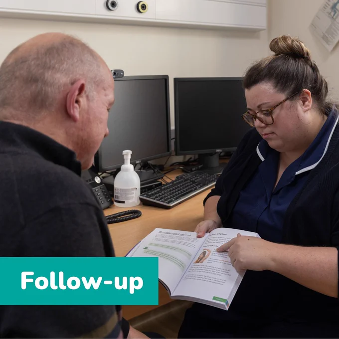 Photo of a man and clinical nurse specialist in a surgery, she is showing him a lymphoma information book. Teal bar bottom let reads "Follow-up".