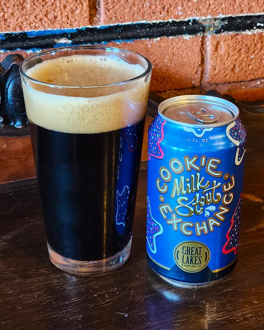Great Lakes Brewing Co. Cookie Exchange Milk Stout can next to a poured pint glass.