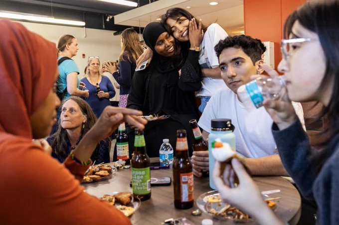 Two students smile and embrace during the welcome-back reception and naming event, for the newly re-named Student Center for Belonging and Community.