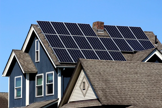 This image shows a house with solar panels on the roof.