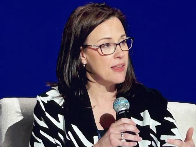 Sally Wentworth speaks into a microphone