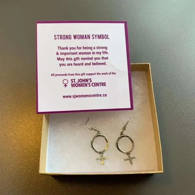 A pair of earrings in stylized female symbols. They are silver looking metal.