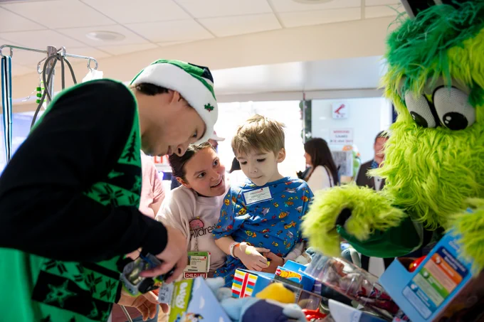 jason gives a gift to a patient