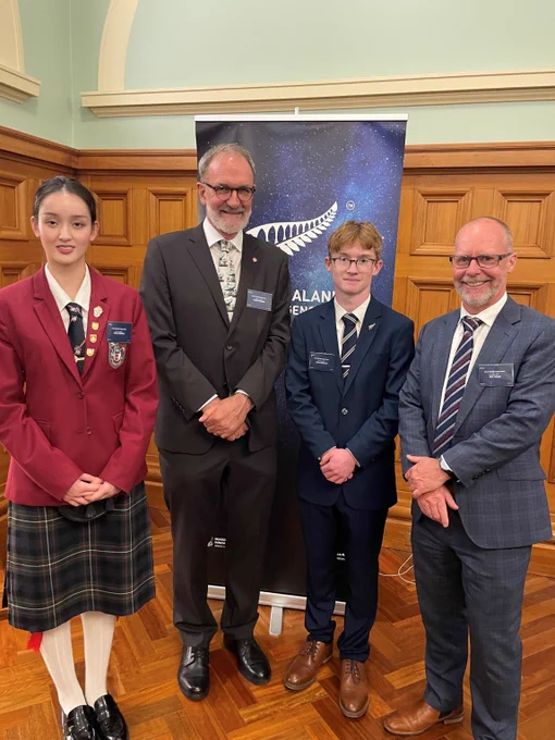 Prime Minister's Space Prize winners Tianyi Mathur, Robin McNeill and Cairo Akehurst with head of the New Zealand Space Agency Iain Cossar. 
