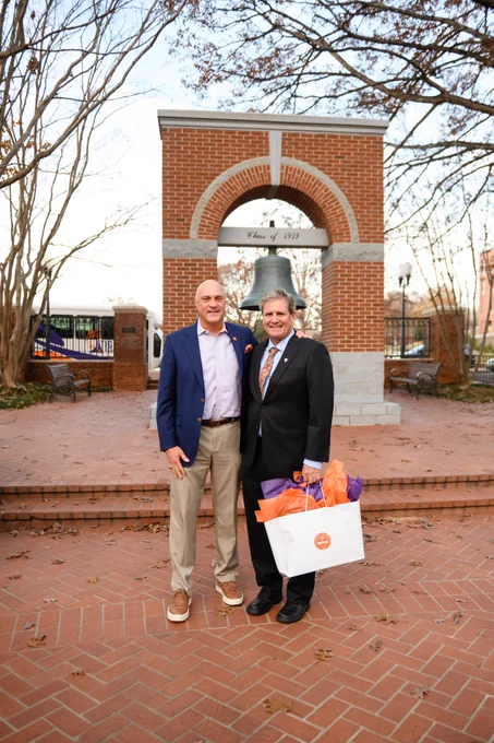 President Clements and Dr. Robert Baldwin posing for a photo in the Carillon Garden.