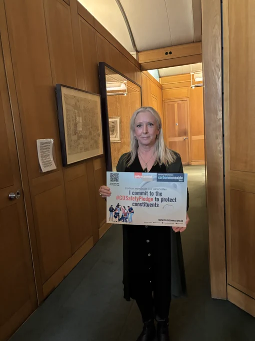 Dr. Roz Savage MP holds the CO Safety Pledge.