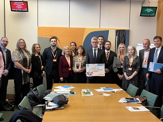 Chair of the session, Al Pinkerton MP, is pictured with session participants. 