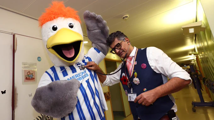Gully poses with a doctor at the Royal Alexandra Hospital in Brighton.