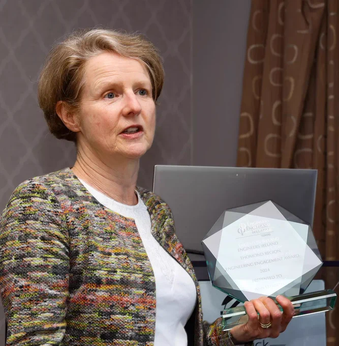 A picture of Professor Ann Ledwith holding an award
