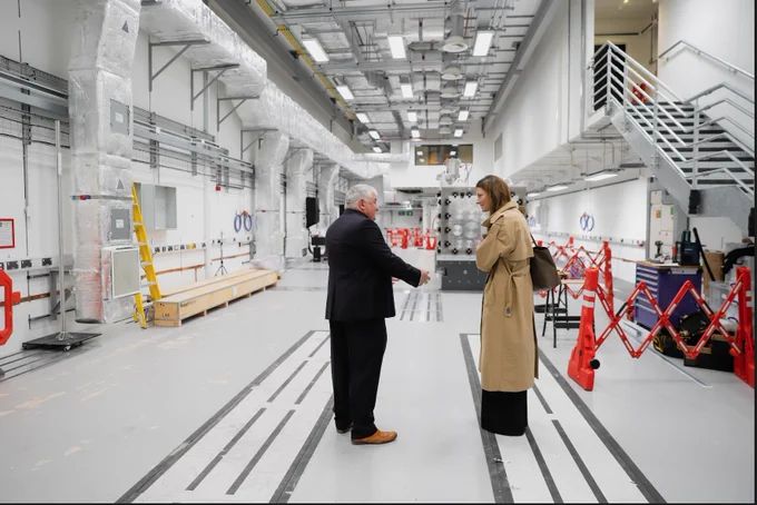 Minister of State Poppy Gustafsson and CLF director John Collier talk in EPAC's expansive Experimental Area 1