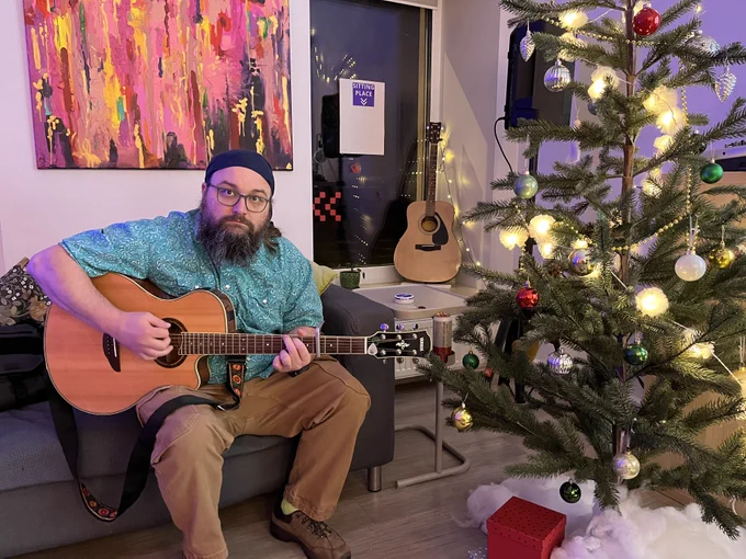Steven Baker playing the guitar. 