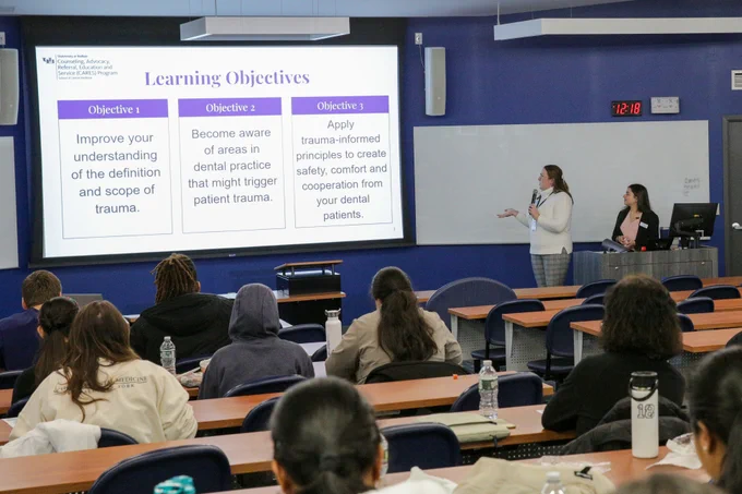 Bess Lehman introduces audience members to their learning objectives, which include understanding trauma, becoming aware of how dental practice could trigger trauma, and applying trauma-informed principles with patients.