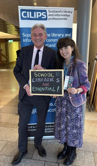 Kirsten and Richard Leonard with a ‘School Libraries are Essential’ blackboard.