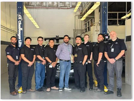 MBUSA instructors stand with the first cohort of Job Corps students who completed the Mercedes-Benz Drive technician training program.