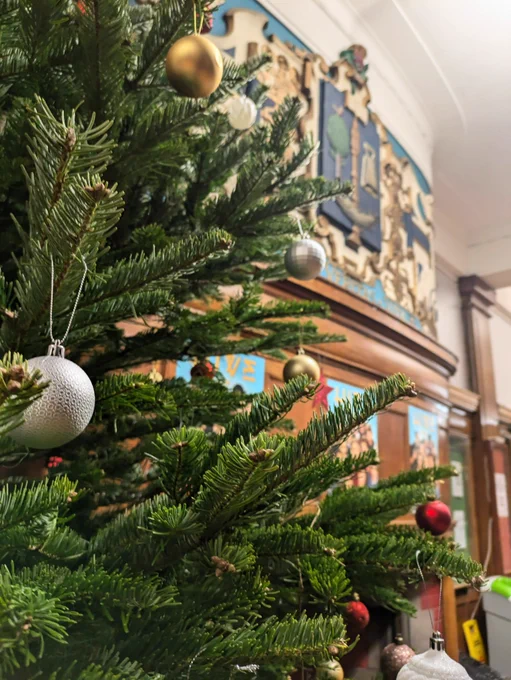 christmas tree in GUU next to mural