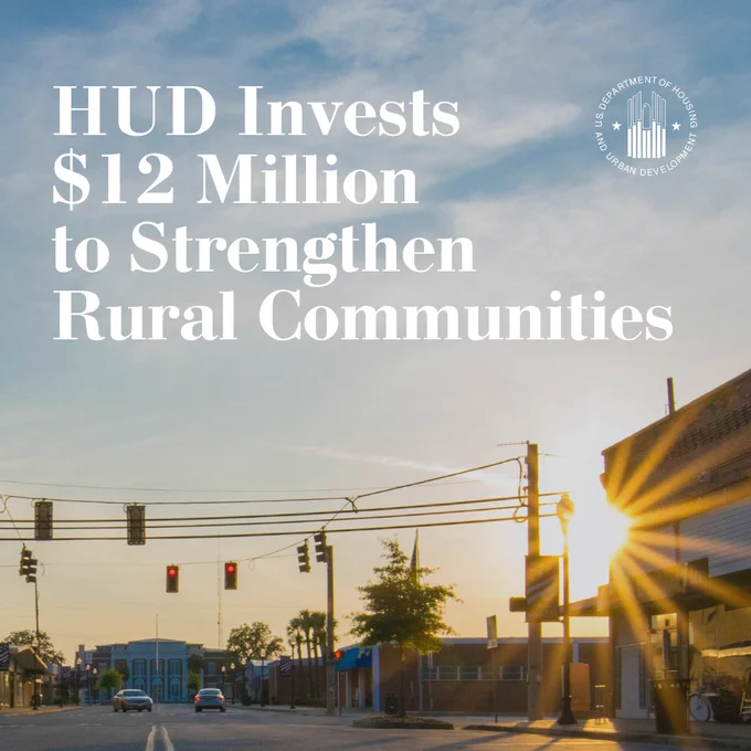 An image of a small town at sunset with text in the sky. The text reads, "HUD Invests $12 Million to Strengthen Rural Communities."