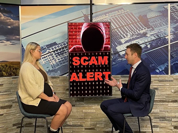 U.S. Attorney Josh Hurwit and CBS2's Savannah Hankard sit down for an interview in-studio. A screen with the words "SCAM ALERT" with a hooded person appears between them.