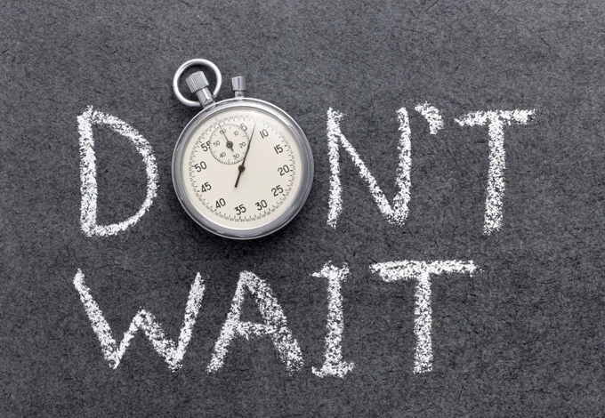 Gray background with the words "Don't Wait" in white and a clockwatch/timer used as the "O" in the word "Don't".
