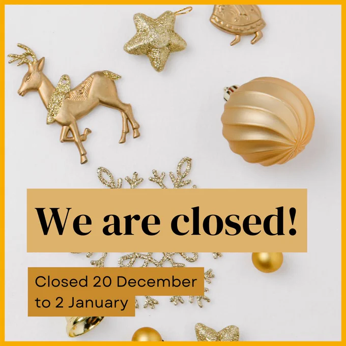 A collection of gold Christmas decorations scattered on a white background. It says that the charity is closed until January 2025